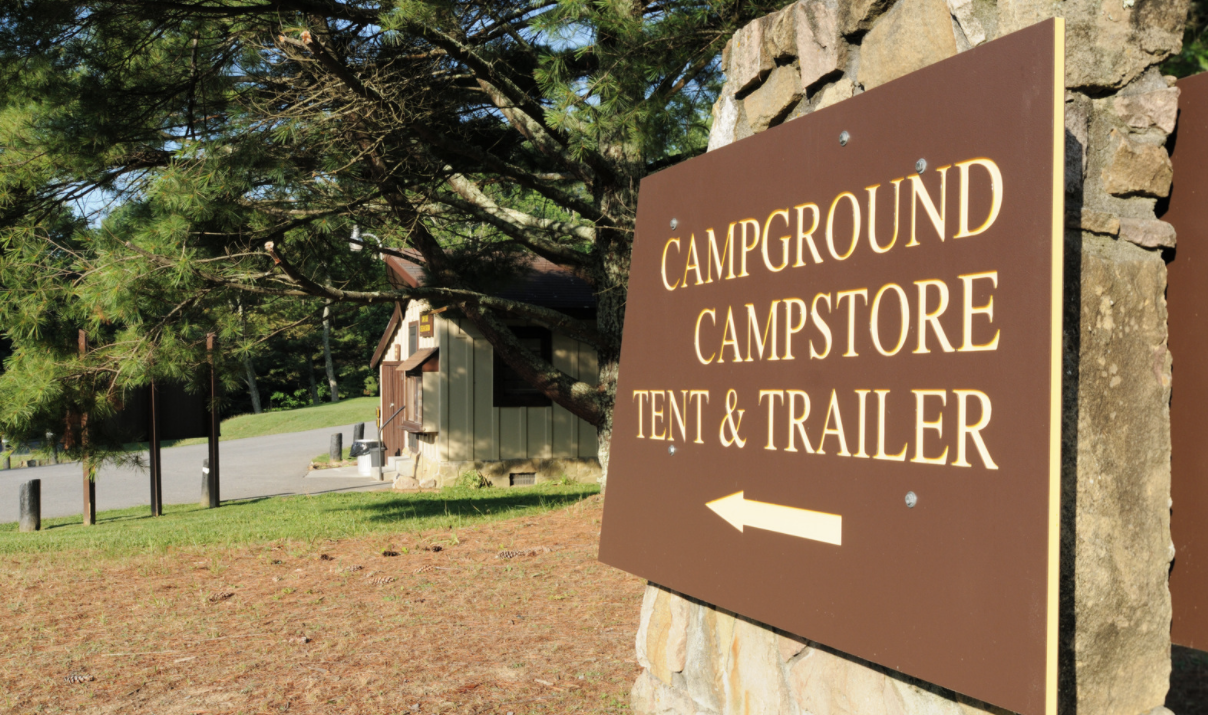 Sign pointing the way to the campground store