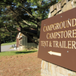 Sign pointing the way to the campground store