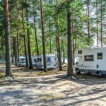 Motor homes in campground near lake summertime in Finland