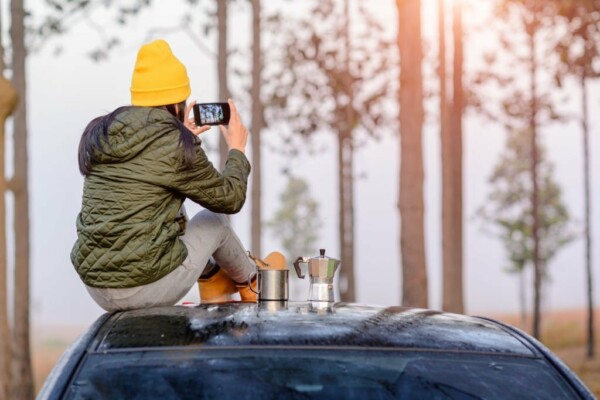 Traveler uploading photos of an RV park to social media