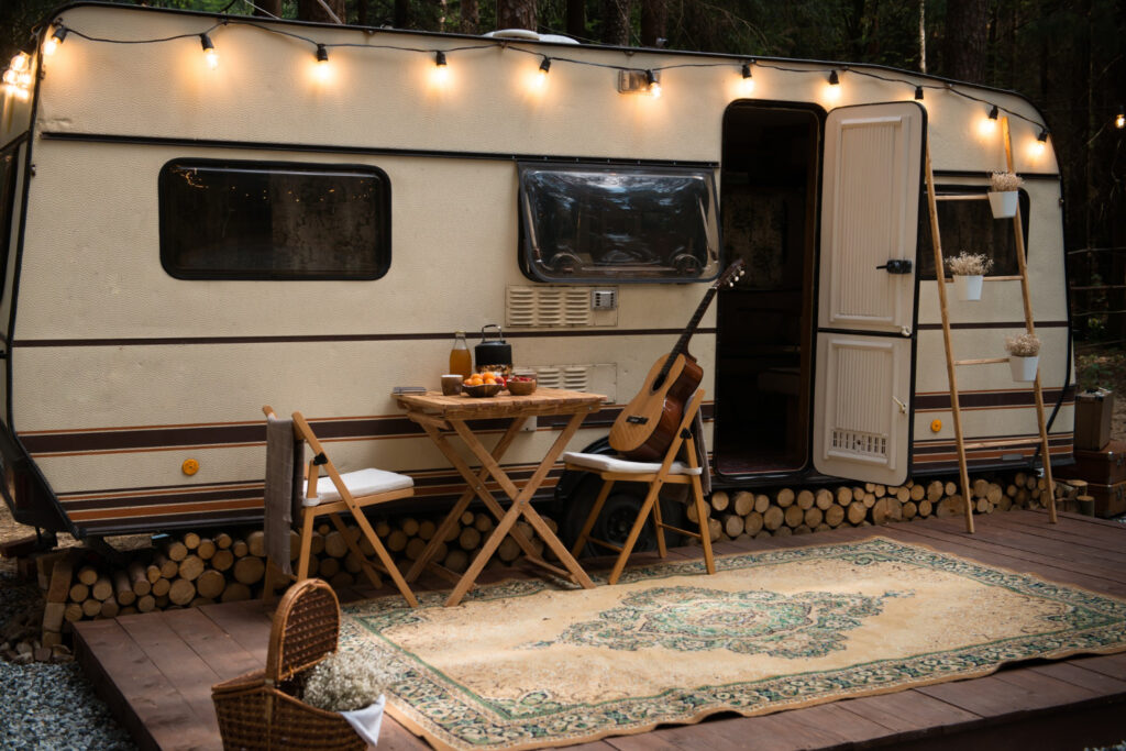 A campground in the forest with a guitar, fruits and lights 