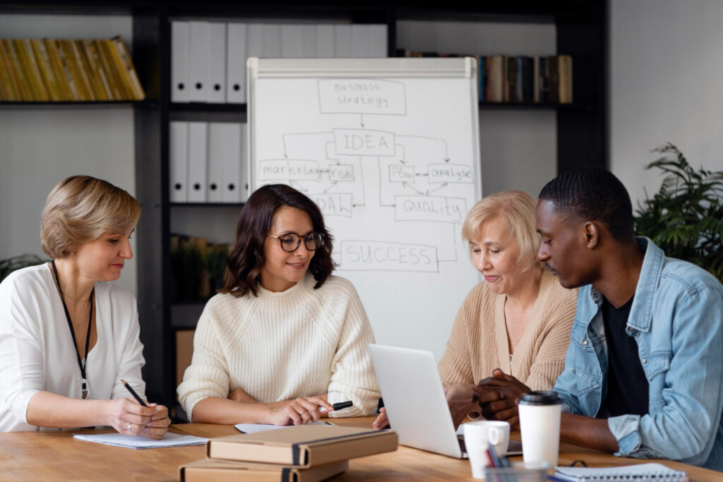 A group of people learning how to use a software 