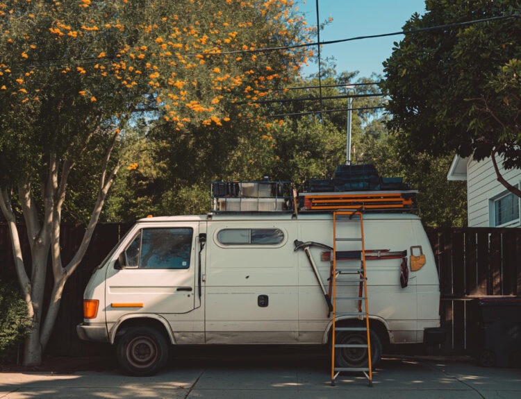 White camper outside of a campsite