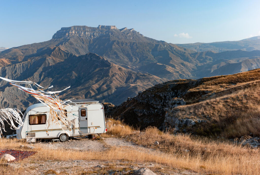 A white camper van in the mountains 