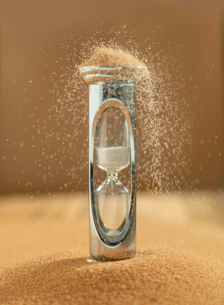 Hourglass inside of a lot of sand