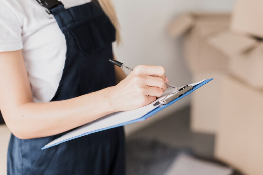 A woman checking the inventory of her RV park to update her campground management software