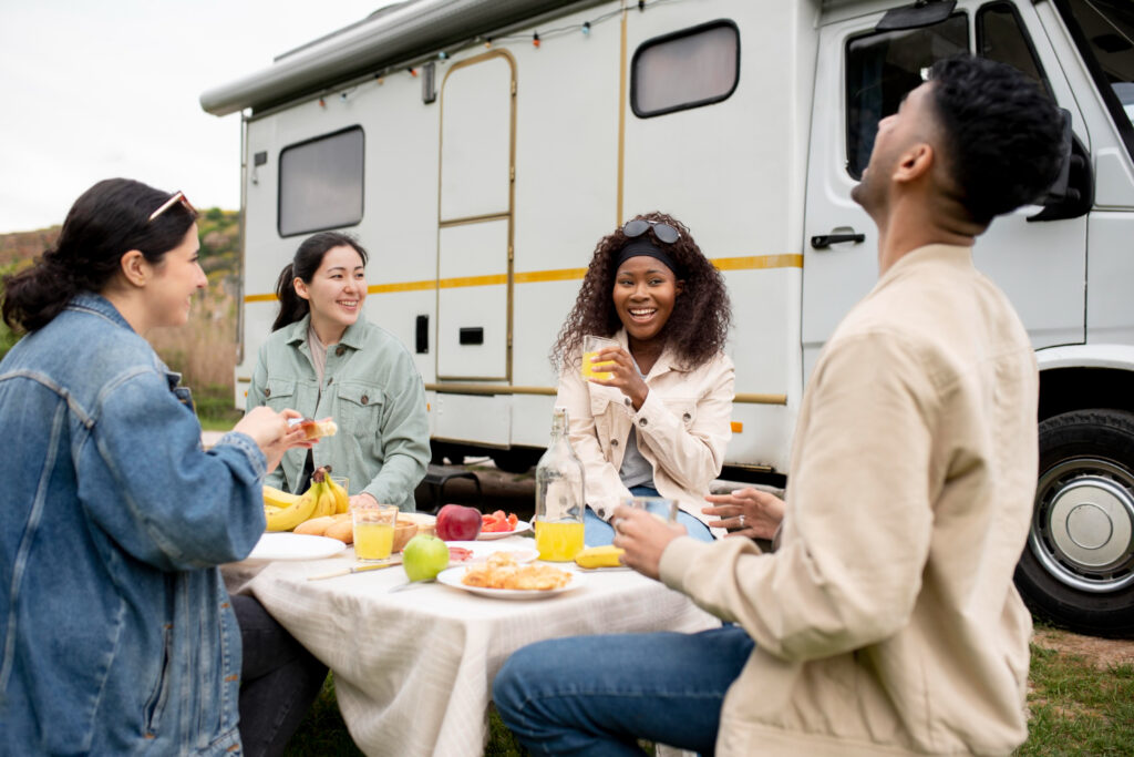 a group of friends enjoying their stay in a RV park thanks to campground reservation software