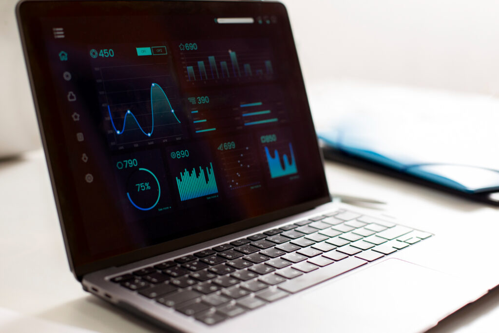 A laptop showing metrics and analytics of a campground software 