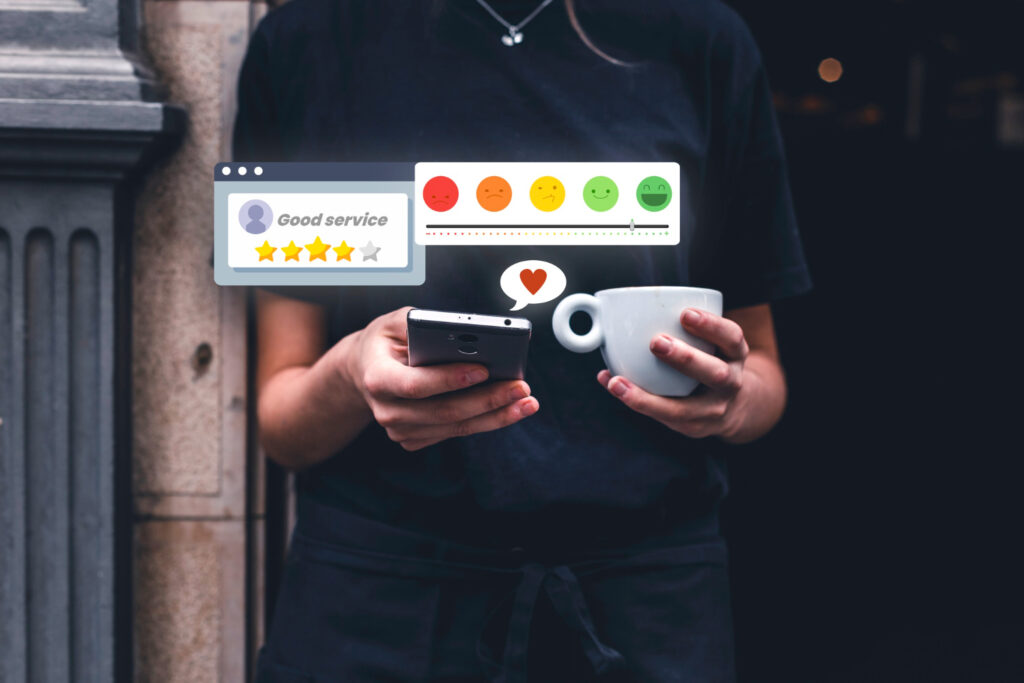 A woman with a black shirt using her phone to give a positive review of a campsite reservation software