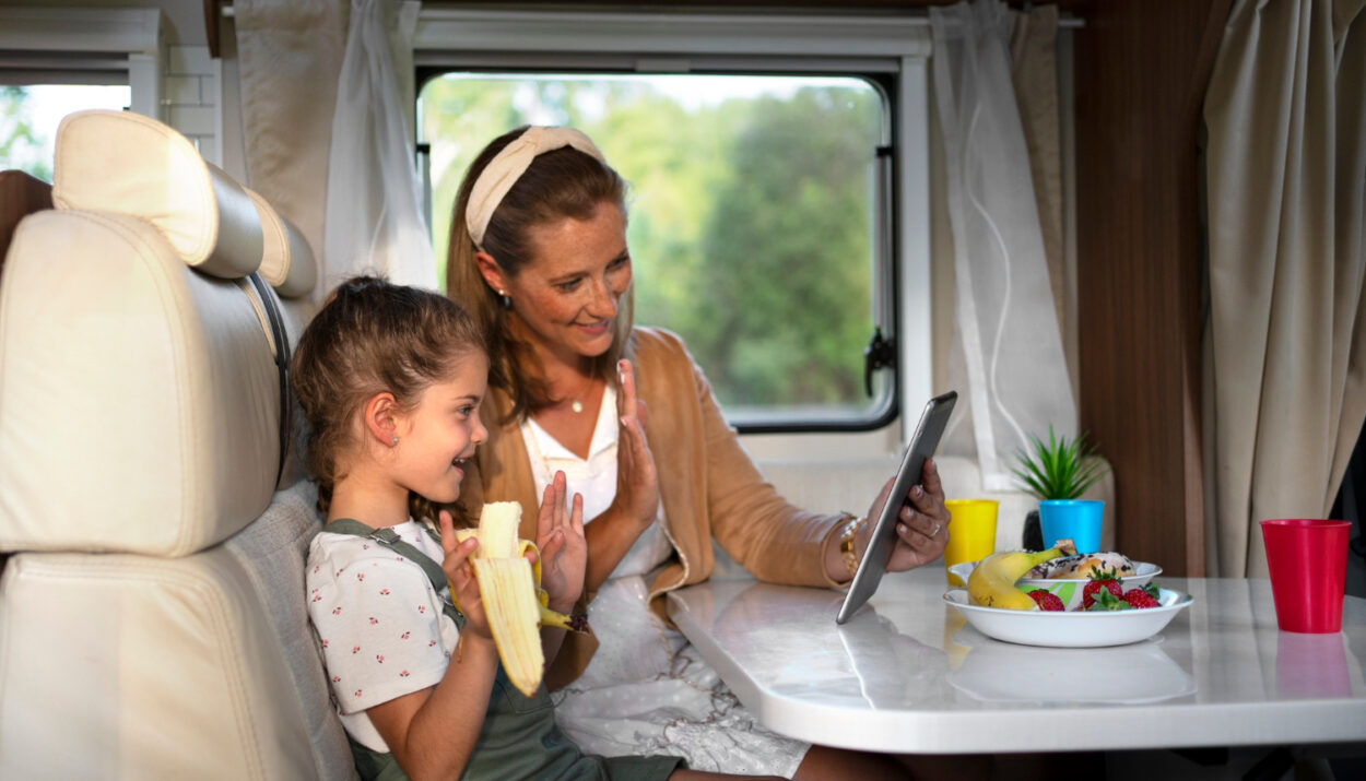 a mother teaching her daugther while in a camper van