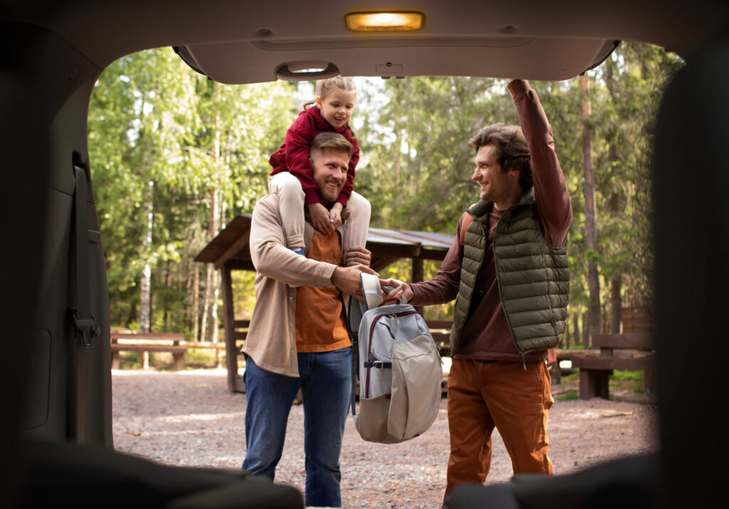 Two men and a child in a campground 