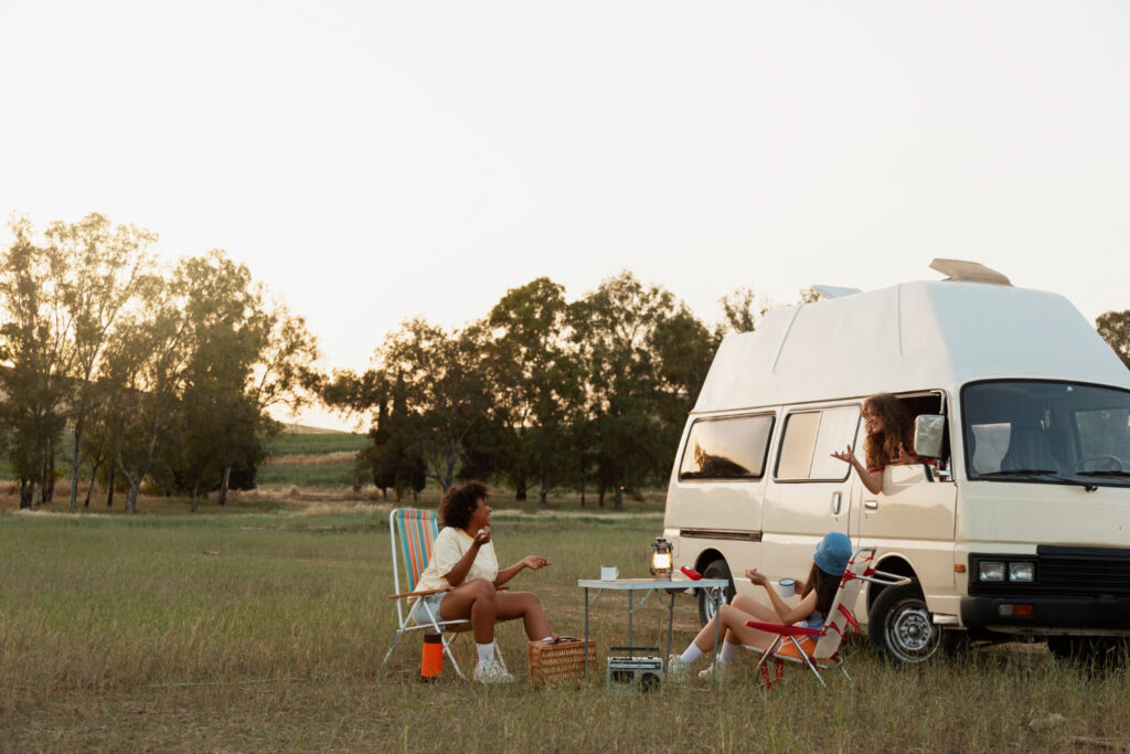 Friends enjoying a day in nature outside of their campground spot