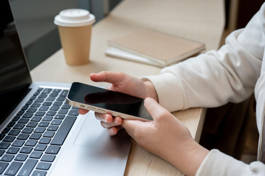 A person using their phone to see payment options of their campsite reservation software