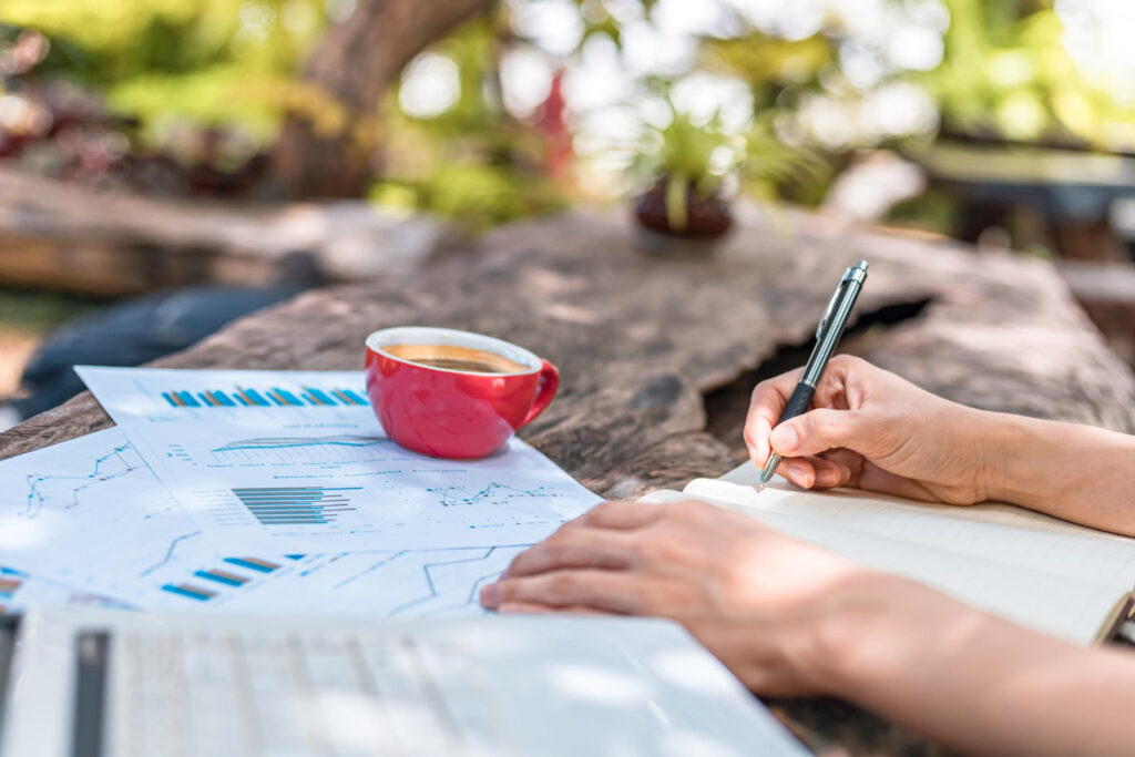 A woman checking the financial reports of her rv park using a campground management software