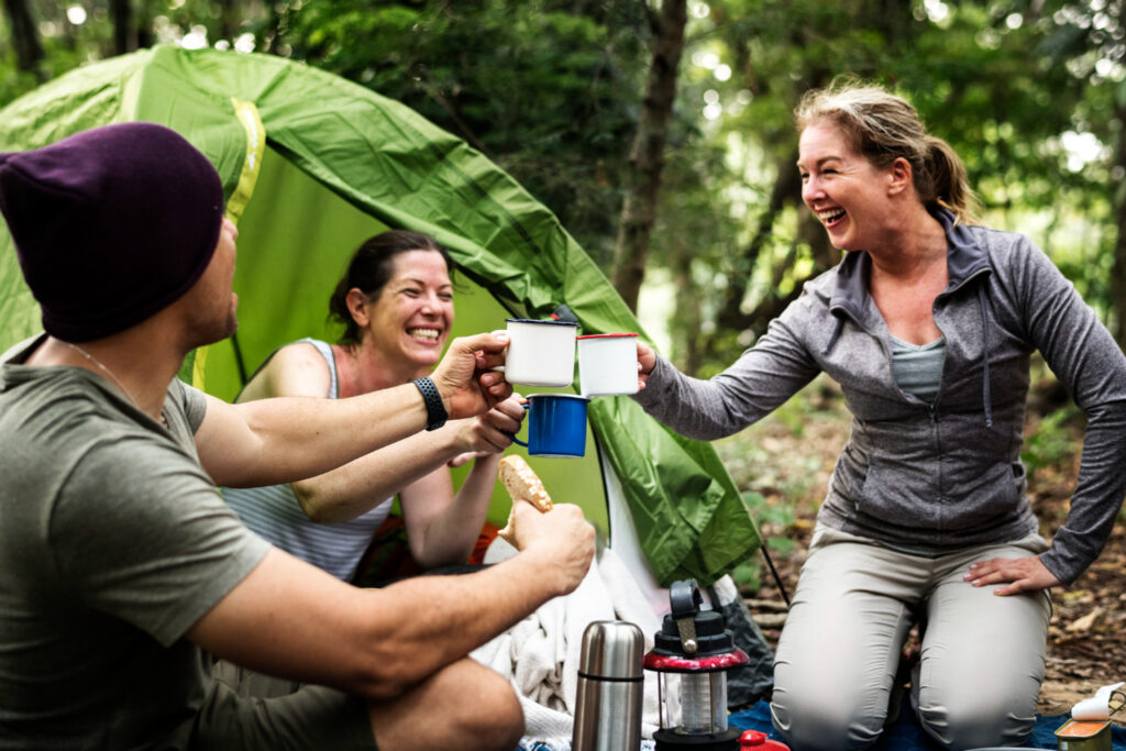 a group of friends having a great customer experience in a campground 