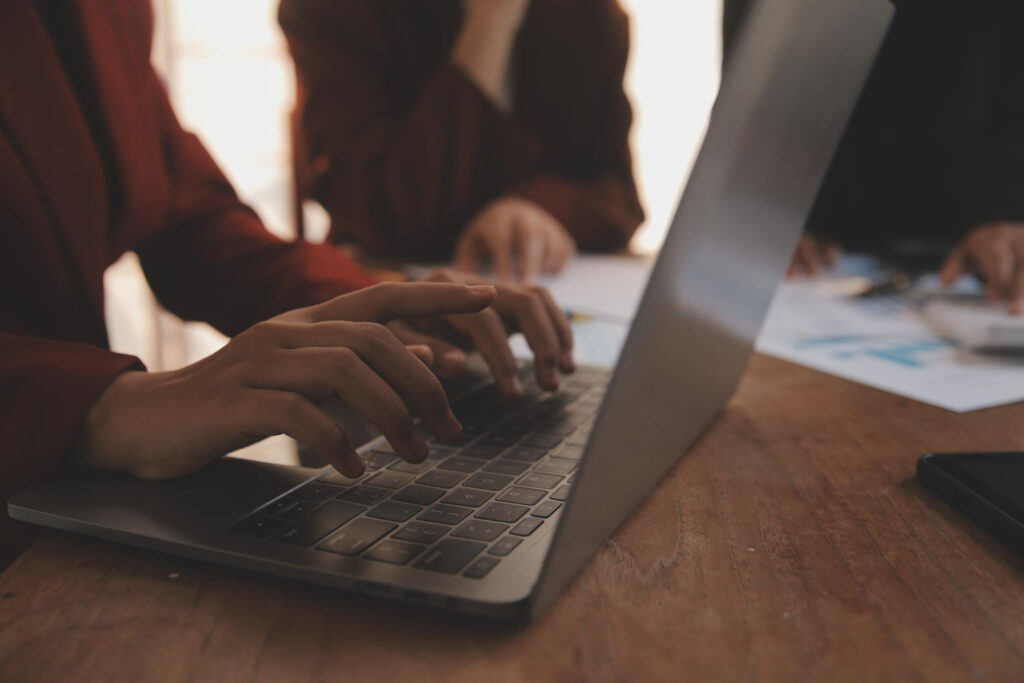 a person checking the data in their laptop using RV park reservation software 