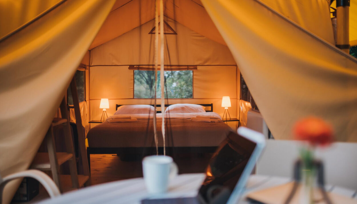 A focused view of a laptop outside of a glamping site