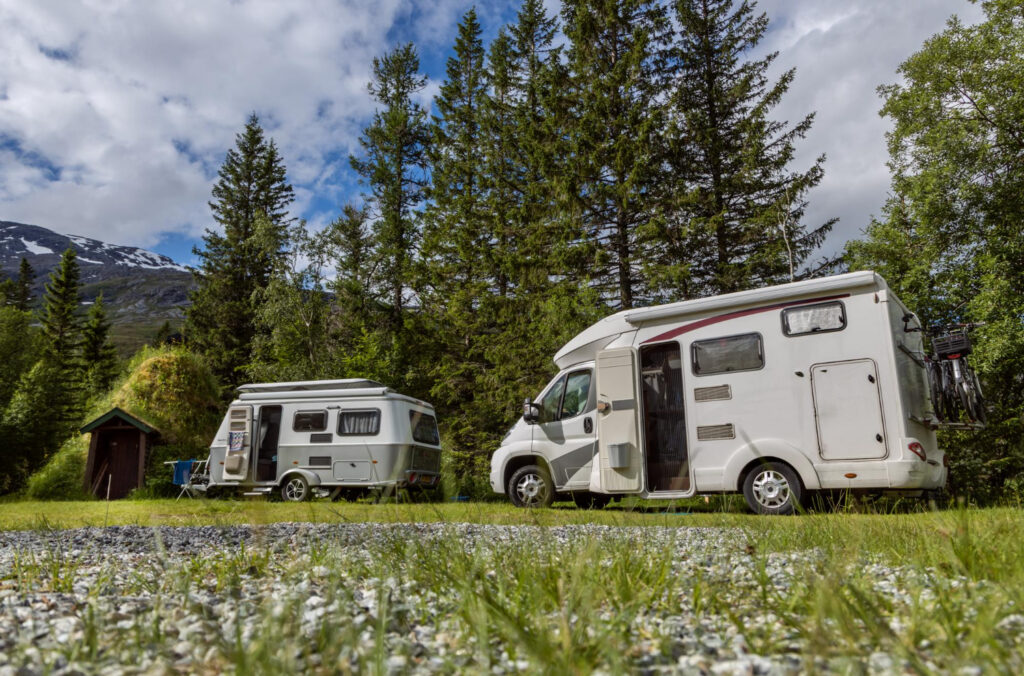 a few camper vans staying in a RV park using reservation software 