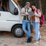 two people looking at a tablet using reservations software for an RV park