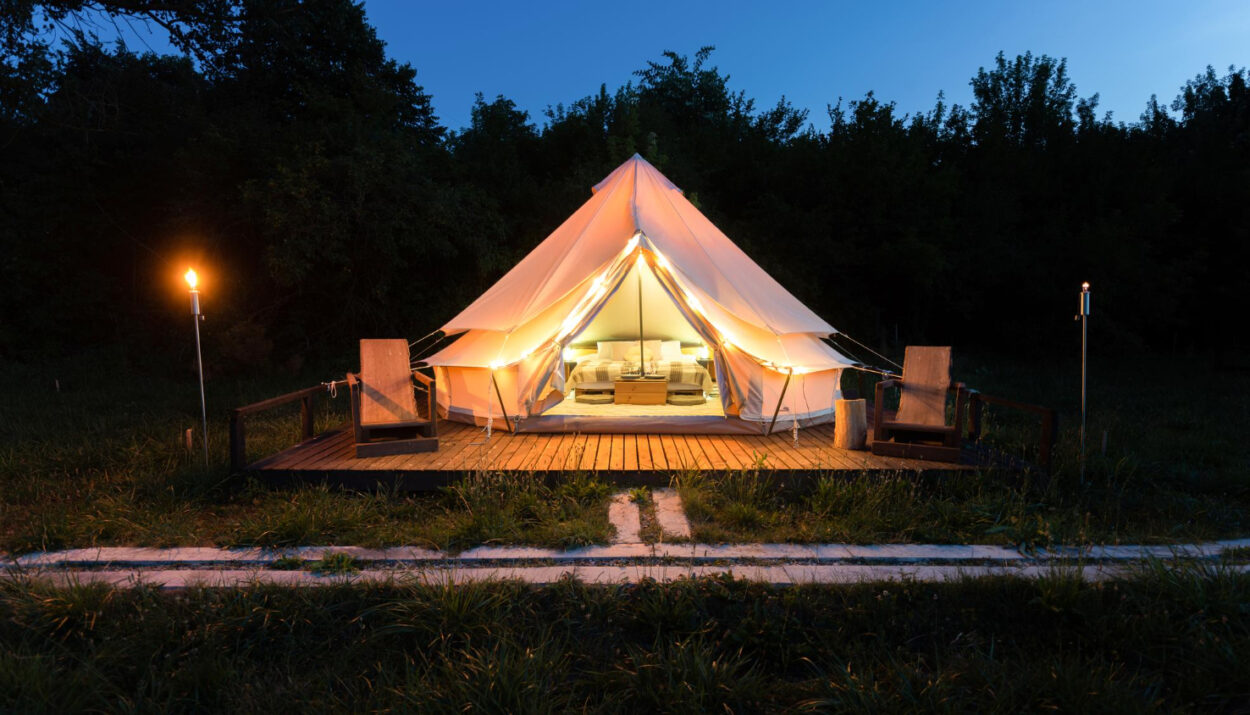 a glamping site using reservation software at night