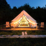 a glamping site using reservation software at night