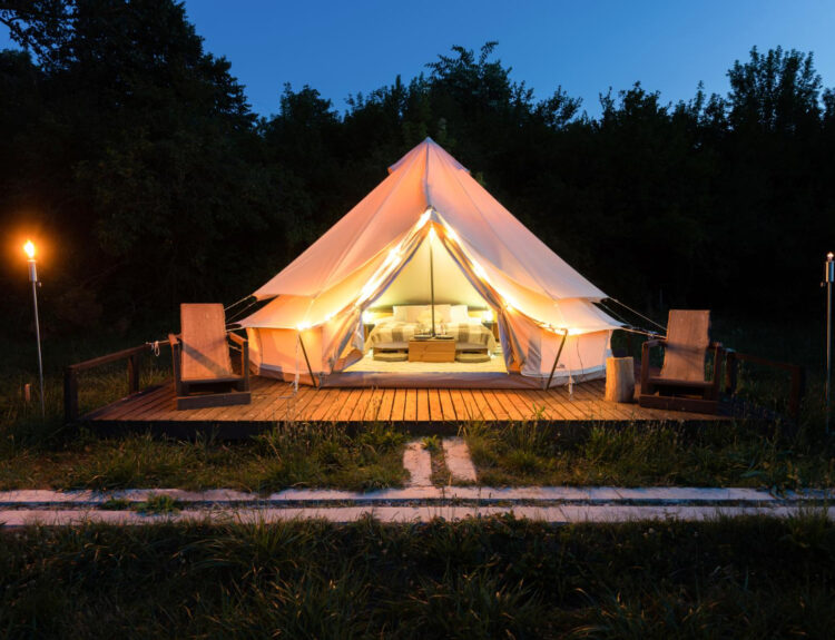 a glamping site using reservation software at night