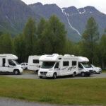 a bunch of camper vans staying in a RV park using reservation software