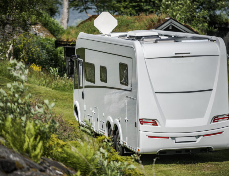 a camper van staying in a RV park using reservation software system