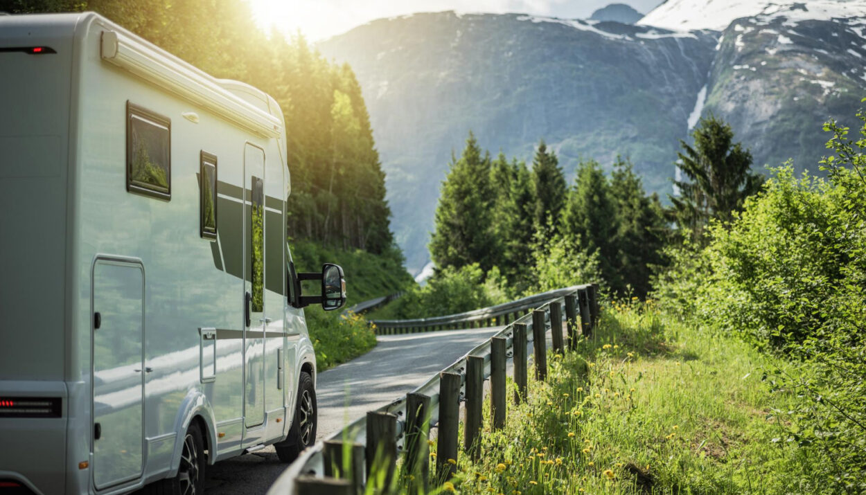 a camper van driving on the road to their next RV park reservation