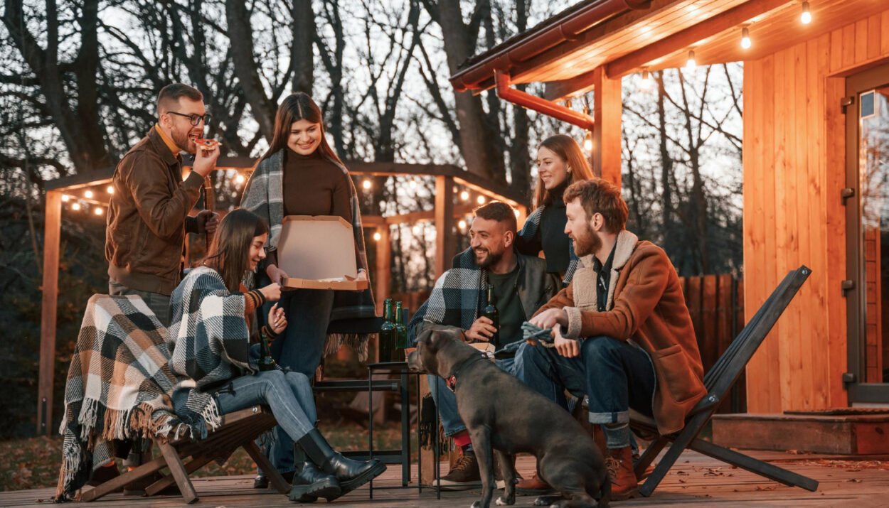 a group of people enjoying a stay in a glamping site using reservation software