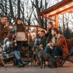 a group of people enjoying a stay in a glamping site using reservation software