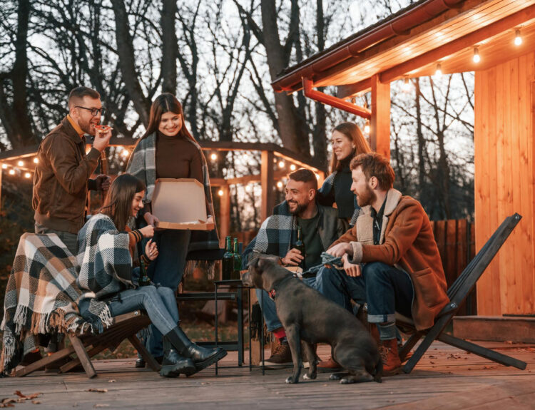 a group of people enjoying a stay in a glamping site using reservation software