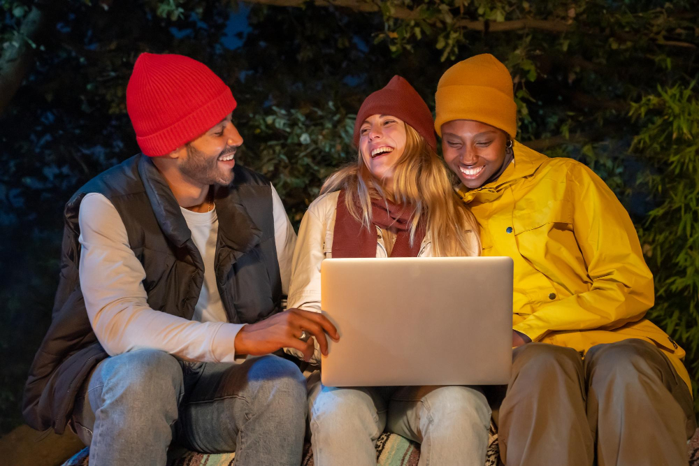 A family using their laptop creat a group booking in a campground for their next camping experience 